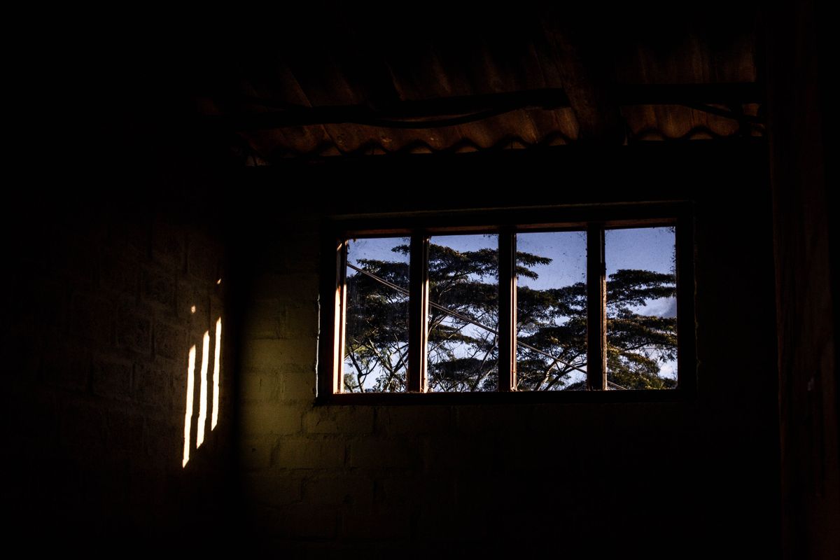 Sunlight streaming into a dark room and being absorbed by the surfaces