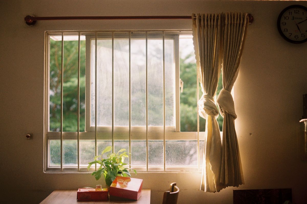 Bright sunlight streaming through a window onto a table, an example of lux levels