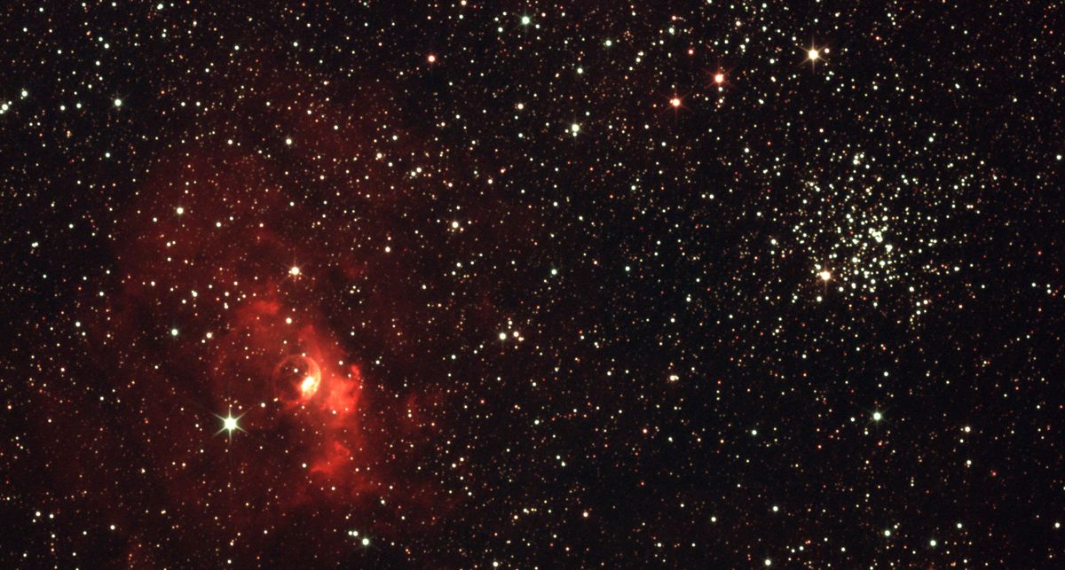 A red star-forming nebula, where the first stars made new light