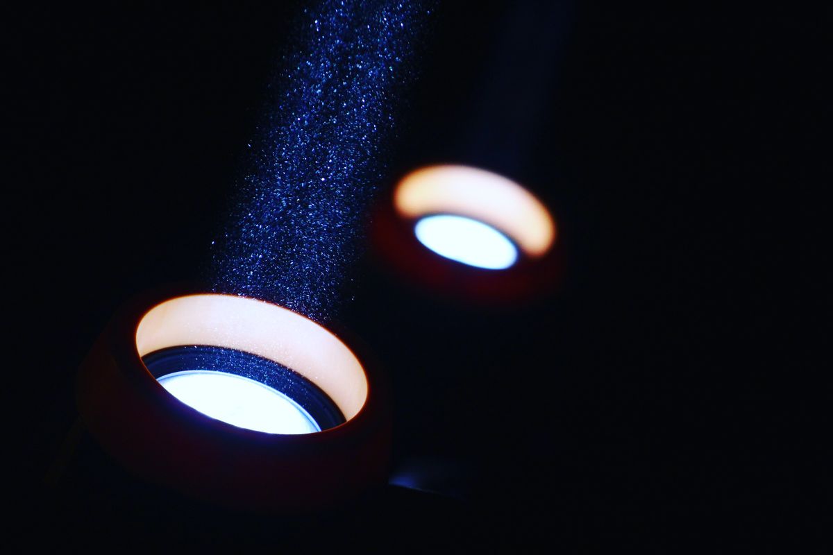 Beams of light illuminating drifting particles in the dark