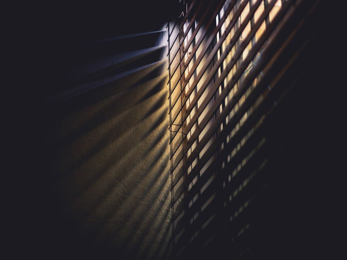 Light and shadow through window blinds, showing absorption, reflection and transmission